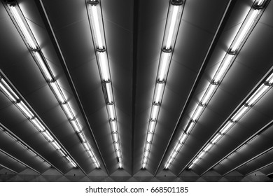 Fluorescent lamps line, view of metro station ceiling - Shutterstock ID 668501185