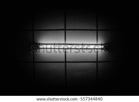 Fluorescent light bulb on the ceiling in the bedroom.