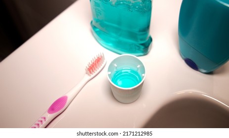 Fluoride Cap And Toothbrush In The Bathroom