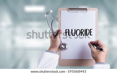 FLUORIDE Medicine doctor hand working Professional doctor use computer and medical equipment all around