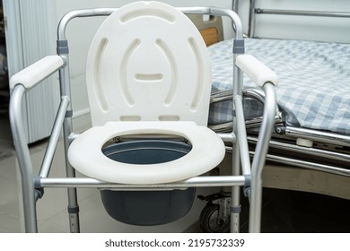 Flush Toilet And Shower Chair In Bathroom For Old Elder People.