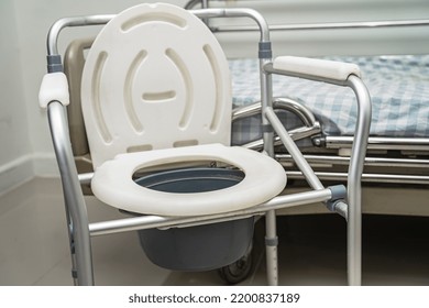 Flush Toilet And Shower Chair In Bathroom For Old Elder People.