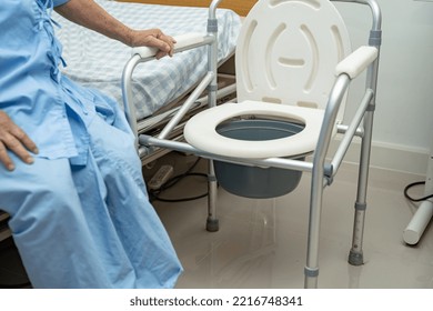 Flush Toilet And Shower Chair In Bathroom For Old Elder People.