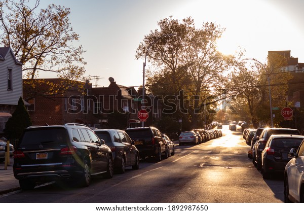Flushing\
Queens, New York USA - November 4 2020: Sun Shining along a\
Residential Street in Flushing Queens New\
York