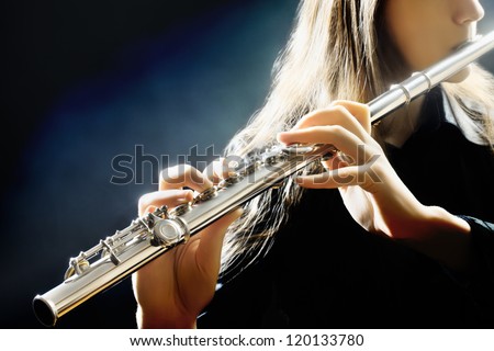 Flute music playing flutist musician performer with bright musical instrument