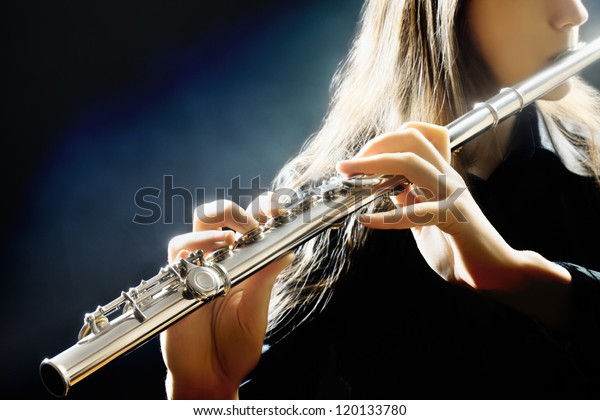 Flute music playing flutist musician performer\
with bright musical\
instrument