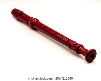 Flute in red color on white background - Shutterstock ID 2064211340