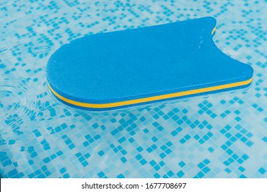 Flutter Board In Swimming Pool With Blue Water
