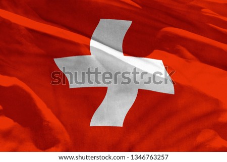 Fluttering Switzerland flag for using as texture or background, the flag is waving on the wind