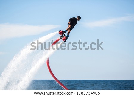 Fly board rider in the ocean