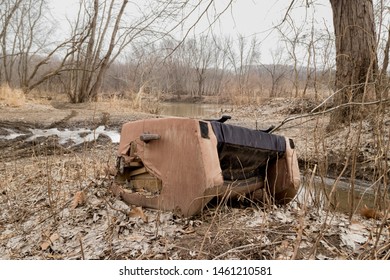 Fly Dumping Of Recliner Chair Off Road Along River Bank