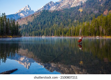 Fly Fisherman Casting His Fly Rod in Lake at Grand Teton National Park - Powered by Shutterstock