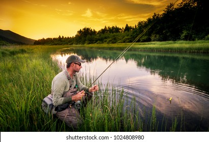 Fly Fisherman Fishing Pike In River
