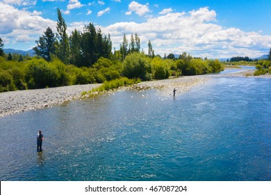 Fly fisherman fishing in the river. New Zealand.