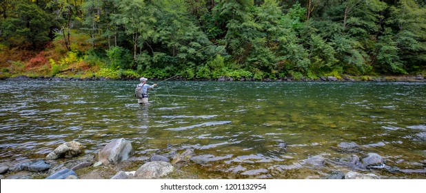 Fly fisherman Spey casting for steelhead on the wild and scenic Rouge River in Southern Oregon