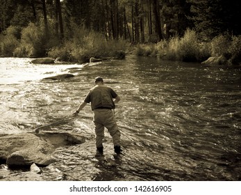 Fly fisherman at Taylor River, Colorado. - Powered by Shutterstock