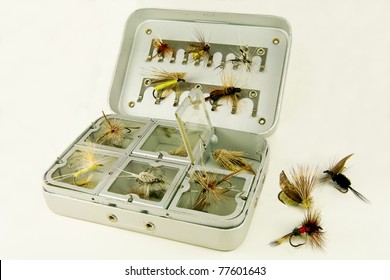 Fly Fishing Box:  A well-used tackle box displays a variety of handmade lures for fly-fishing.