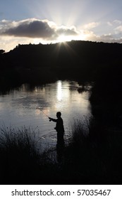 Fly Fishing Silhouette At Sunrise