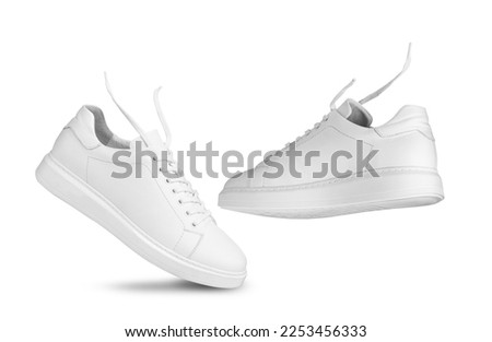 Fly White sneakers and floating ropes. Isolated on a white background