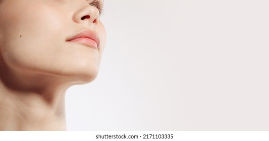 Flyer. Closeup female lips, cheeks and nose isolated over white studio background. Natural beauty. Concept of natural beauty, cosmetology, skincare, cosmetics, plastic surgery, ad