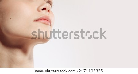 Flyer. Closeup female lips, cheeks and nose isolated over white studio background. Natural beauty. Concept of natural beauty, cosmetology, skincare, cosmetics, plastic surgery, ad