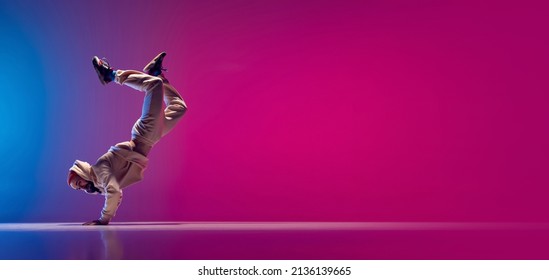 Flyer with young flexible sportive man dancing breakdance in white outfit on gradient pink blue background. Concept of action, art, beauty, sport, youth. Dancer shows breakdance figures