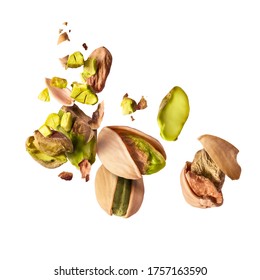 Flying in air fresh raw whole and cracked pistachios  isolated on white background. Concept of Pistachios is torn to pieces close-up. High resolution image