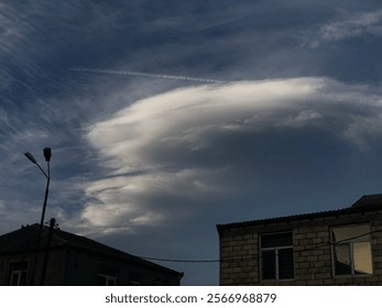 A flying airplane and its trace in the blue sky - Powered by Shutterstock