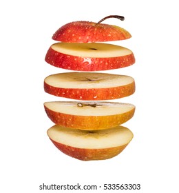 Flying Apple. Sliced Red Apple Isolated On White Background. Levity Fruit Floating In The Air