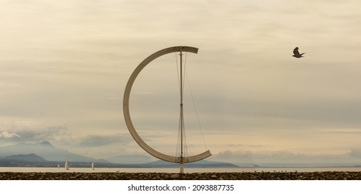 Flying Bird, Lake, Boats, Yachts Mountains, And A Half-circle At The Lake 