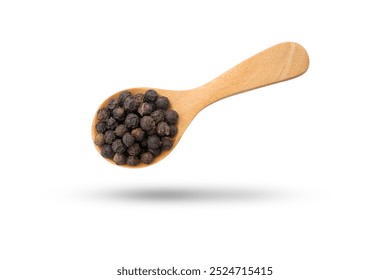 Flying black pepper or peppercorns in wooden spoon isolated on white background , clipping path.