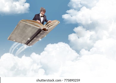 Flying Book Over The Clouds