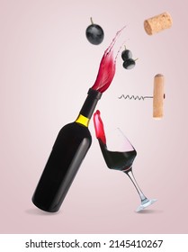 Flying Bottle Of Red Wine, Glass, Cork, Opener And Grapes On Light Color Background