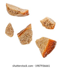 Flying Bread Pieces Isolated On White Background.  Bread Crumbs Macro. 