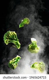 Flying Brocolli With Steam On Black Background