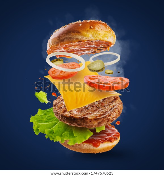 Flying burger slices. Burger ingredients:\
salad, onion, beef, pickles, ketchup. Hot burger. Grilled burger,\
flavorful and delicious.