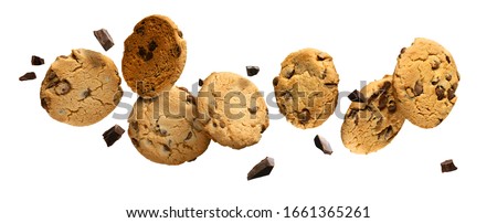 Flying Chocolate chip cookies with pieces of chocolate isolated on white background. High resolution image.