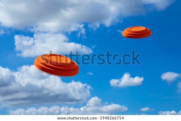 Flying clay disc target shooting on the blue sky ,\
Clay pigeon targets game