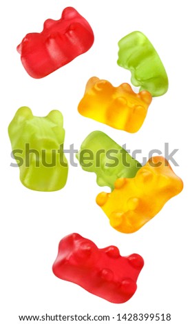 Flying colorful jelly gummy bears, isolated on white background