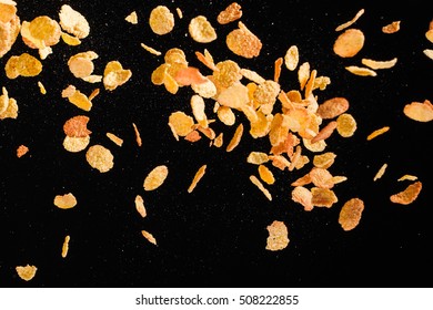 Flying Corn Flakes Isolated On Black Background