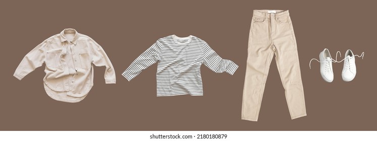Flying cotton longsleeve, beige jeans, denim shirt, white leather sneakers isolated on brown background. Clean white Unisex T-shirt. Branding clothes. Mock up for your design. Autumn Women's Clothing - Shutterstock ID 2180180879