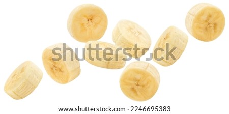 Flying delicious banana slices, isolated on white background