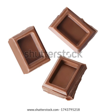 Flying delicious chocolate pieces, isolated on white background