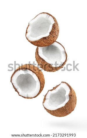 Flying delicious coconuts, isolated on white background