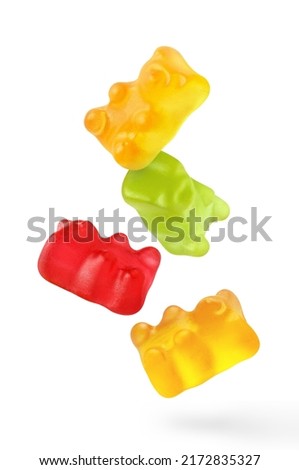 Flying delicious jelly gummy bears, isolated on white background