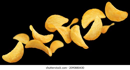 Flying delicious potato chips, isolated on black background - Powered by Shutterstock