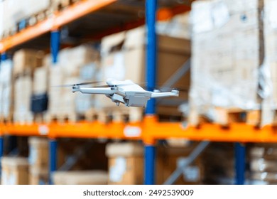 Flying delivery drone transferring parcel box from distribution warehouse - Powered by Shutterstock