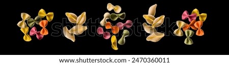 Flying of different type of pasta isolated on black background.