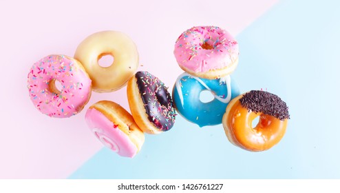 flying doughnuts on blue and pink background banner