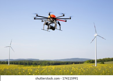 Flying drone in field - field in Germany
